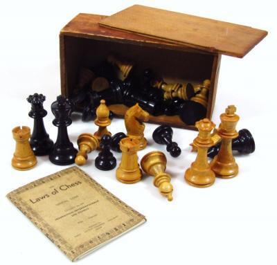 An early 20thC polished wooden Staunton chess set