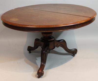 A Victorian mahogany supper table