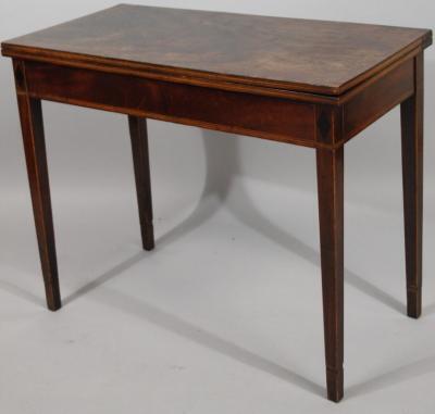 A George III mahogany fold-over tea table