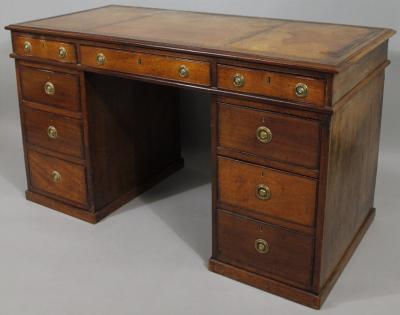 A late 19thC mahogany twin pedestal desk