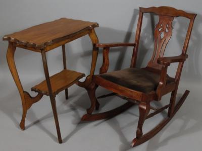 An early 20thC stained mahogany finish Chippendale design rocking chair