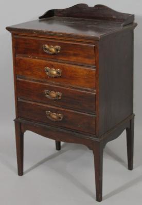 An Edwardian stained walnut sheet music cabinet