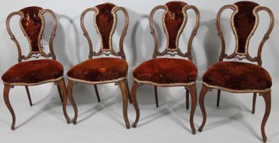 A set of four early 20thC French walnut salon chairs