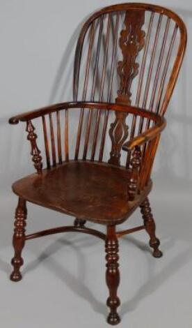 A 19thC yew and elm high back Windsor chair