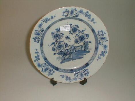 An 18thC Delft dish, painted to the rim with five flower sprays, lozenge