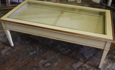 A 20thC glass topped display cabinet Grange coffee table