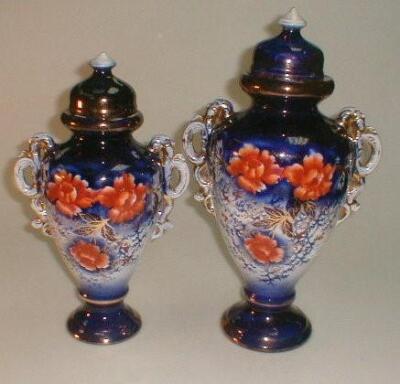 2 early 20thC pottery ovoid vases and covers