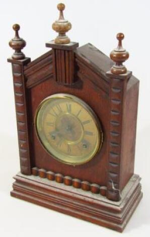 An early 20thC Ansonia oak cased mantel clock