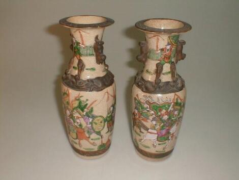 A pair of 19thC Chinese baluster vases with equestrian scene