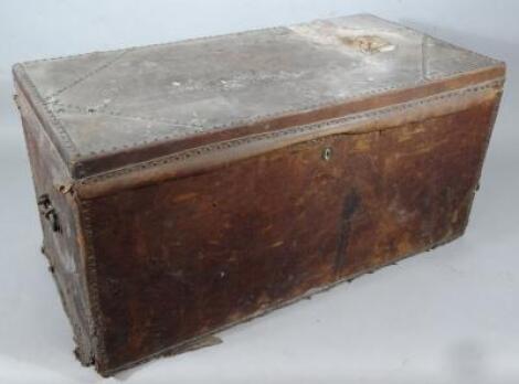 A pressed leather wooden bound travel trunk