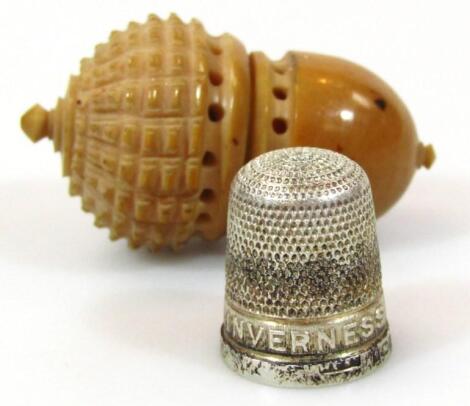 A polished nut shaped thimble case