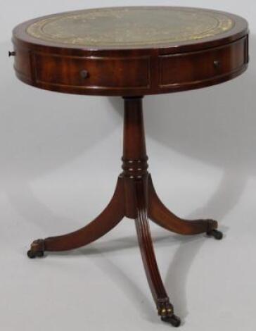 A 20thC mahogany finished drum table