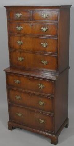 A 20thC mahogany bureau cabinet