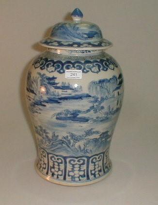 A Chinese blue and white export baluster vase and cover