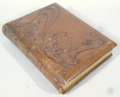 A late Victorian pressed leather photograph album