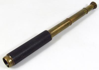 An early 20thC brass three draw telescope, stamped Falcon, London, Made In England, compressed black leather end and open viewer, (when closed) 18.5cm wide.