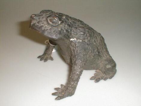 A bronze cast model of a toad