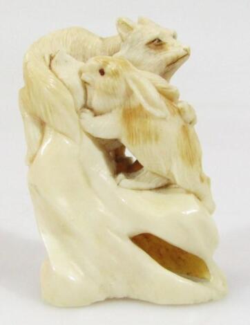 A 19thC Japanese Meiji period ivory carving of a rabbit and fox