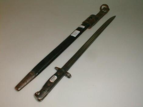 A WWI bayonet in black metal stamped Wilkinson