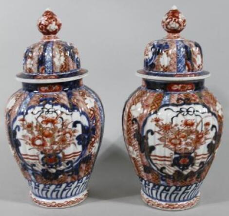 A pair of 19thC Imari vases