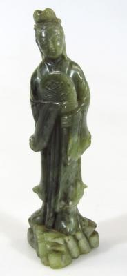 A 20thC Chinese green jade figure of a standing lady holding fan