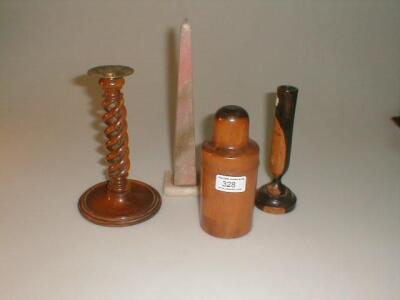 An olive wood twist candlestick