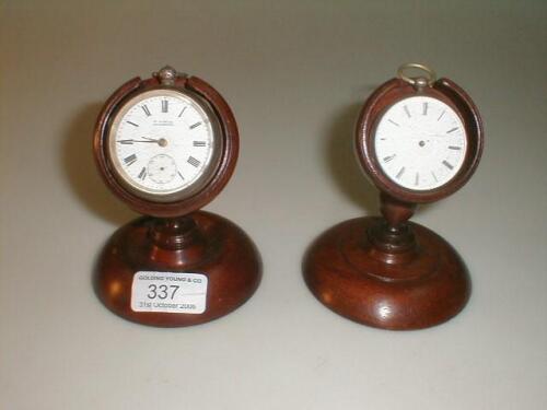 Two treen watch stands and a pocket watches