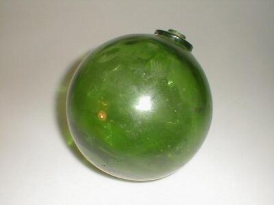 A large green glass fisherman's float