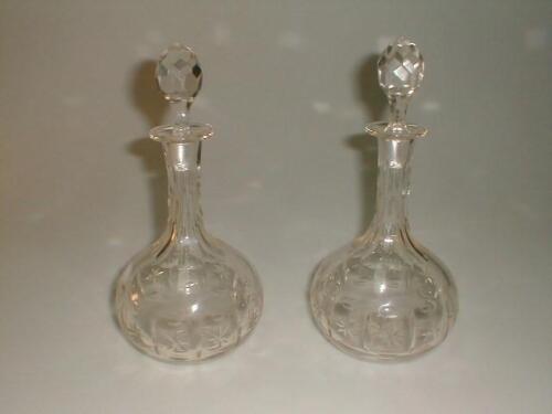 A pair of 19thC cut glass decanters