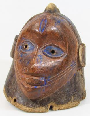 A carved tribal Yuraba wooden helmet mask