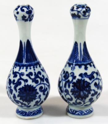 A pair of Chinese Kangxi style blue and white gourd vases