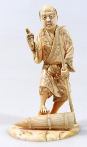 An early 20thC Japanese ivory okimono figure