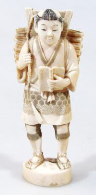 An early 20thC Japanese okimono figure of a gentleman