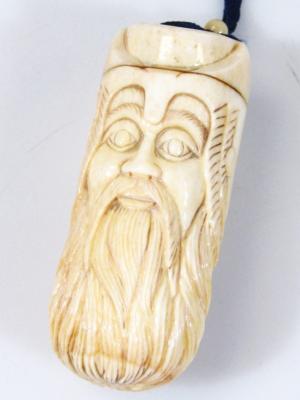 A Japanese sake bottle netsuke