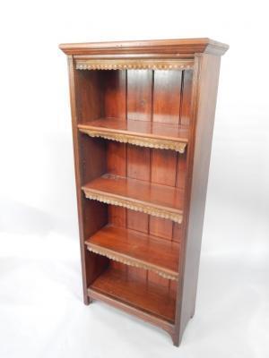 A mahogany open bookcase