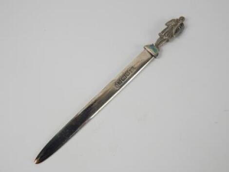 A silver paper knife with a knight crusader handle