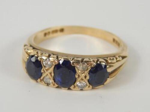 A 9ct gold and sapphire three stone ring