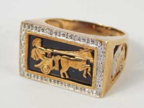 A gentleman's 9ct gold black onyx and diamond set ring