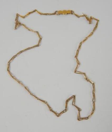 A yellow metal fancy link neck chain