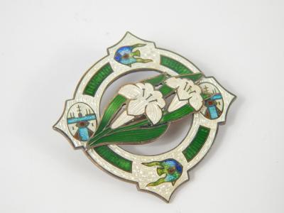 An Arts & Crafts silver green and white guilloche enamel brooch