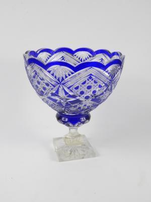 A Continental blue flashed glass pedestal fruit bowl