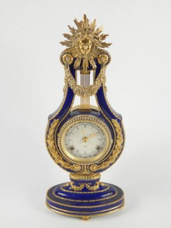 A Victoria & Albert Museum porcelain and brass Marie Antoinette mantel clock