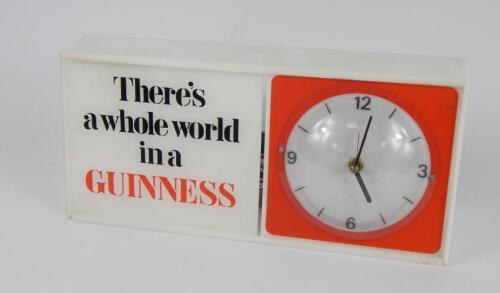 A Guinness plastic and perspex cased electric mantel clock