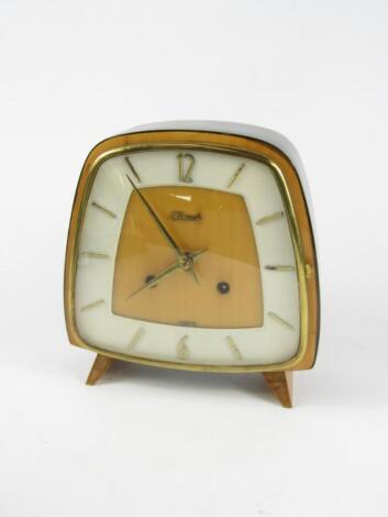 A Hermle 1950's ebonised and pale wood cased mantel clock