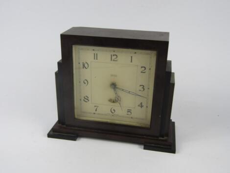 A Smith bi-coloured bakelite electric clock