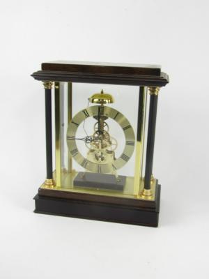 A wooden and brass cased skeleton clock