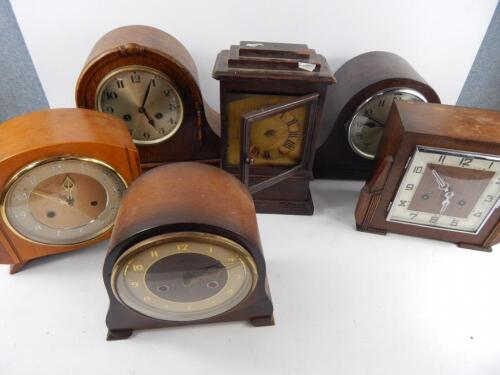 A group of oak cased mantel clocks