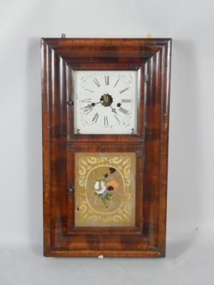 An American late 19thC mahogany and walnut rectangular cased shelf clock