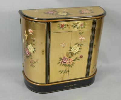 A gilt and black lacquered chiffonier