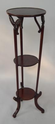 An Edwardian mahogany and boxwood line inlaid three tier jardiniere stand